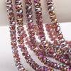 Strands of faceted crystal glass beads in shades of pink and purple with a wheel shape for jewelry making