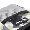 A close-up view of a black pet training treat pouch for dogs with a camouflage pattern.