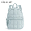 A light blue quilted laptop backpack with a zipper closure and adjustable straps.