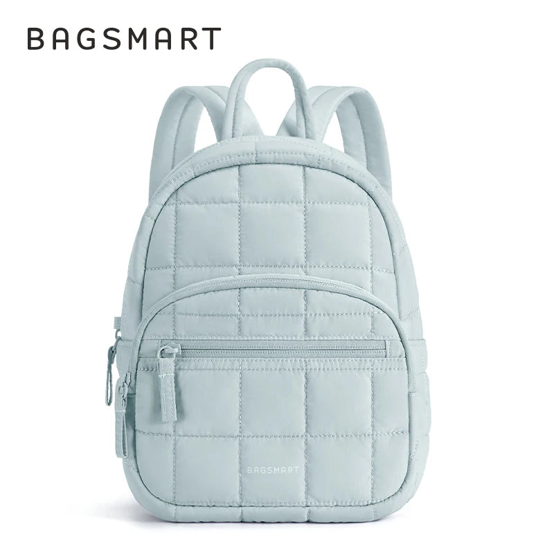A light blue quilted laptop backpack with a zipper closure and adjustable straps.