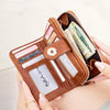 A close-up of a brown leather RFID blocking multi-function women's wallet with various cards and cash inside.