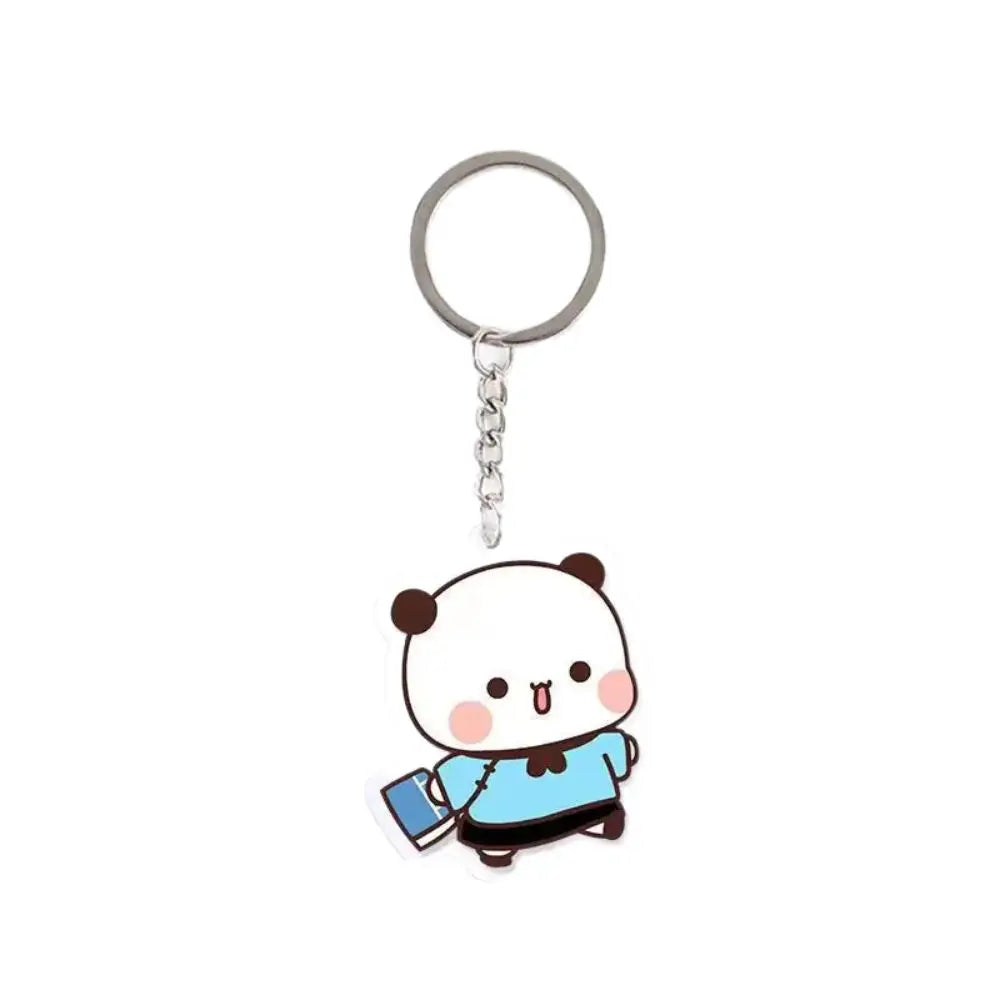 A cute cartoon character keychain charm featuring a white and blue face on a silver ring.