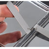 A hand opens a premium metal cigarette holder, showing the sliding mechanism and reflective surface.