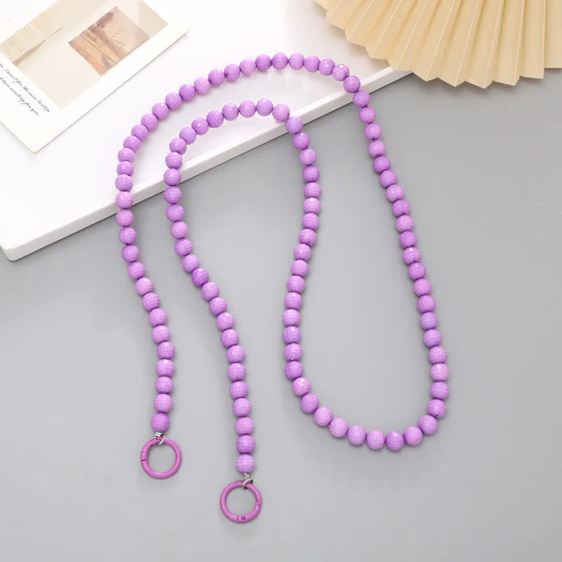 Purple acrylic bead cross phone charm necklace with a gold-colored clasp