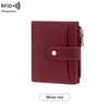 A maroon compact wallet with a flap closure and coin pouch.