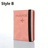 A pink passport holder with a black strap and a silver airplane emblem.