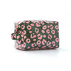 A green and pink leopard print cosmetic bag lying flat on a white surface.