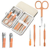 A stainless steel nail clipper set kit with various tools and scissors in a light beige case.