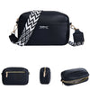 Black leather zipper shoulder bag with a diagonal white chevron pattern and black strap