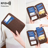 A brown passport wallet with a wrist strap is shown open, displaying several passports and cards for protection.