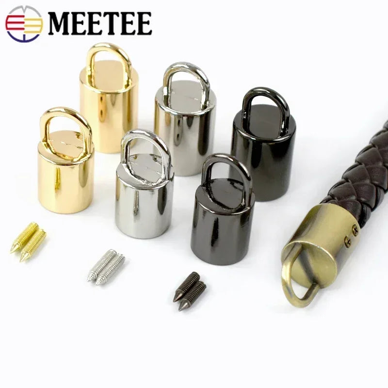 A collection of metal cord lock buckles in gold and black finishes, including various sizes and styles.
