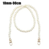 A strand of white pearls used as a strap for a handbag or purse.