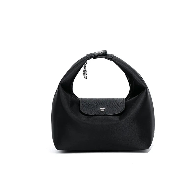Black waterproof nylon crossbody bag with dual straps shown from the front.