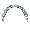 A curved, chunky, light gray acrylic chain shoulder strap for a handbag.