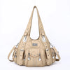 A beige vintage PU leather hobo shoulder bag with silver hardware and a long strap.