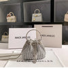 Silver crystal-embellished evening clutch with chain displayed on a white surface.