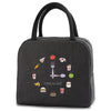 Black insulated canvas lunch bag featuring various food icons like a fork, sandwich, and apple.