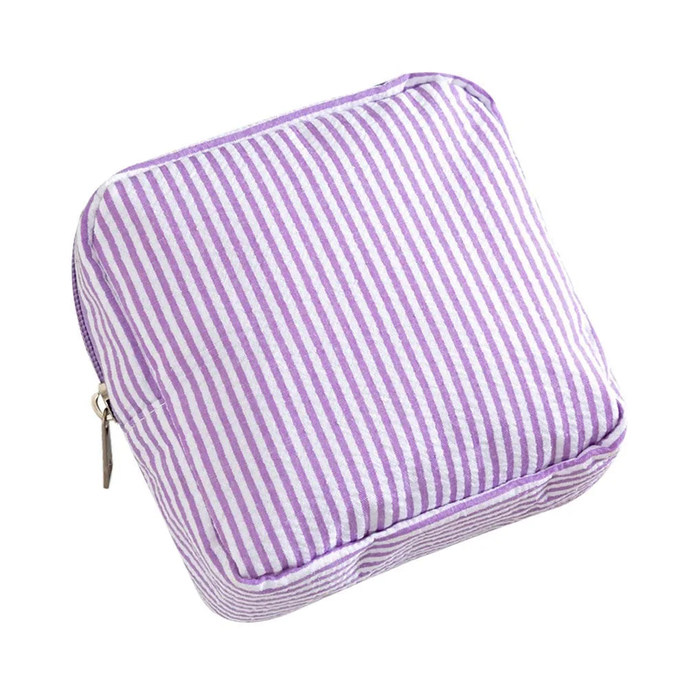 Purple and white striped multi-functional storage pouch.