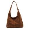 A brown suede slouchy shoulder bag with a long strap.