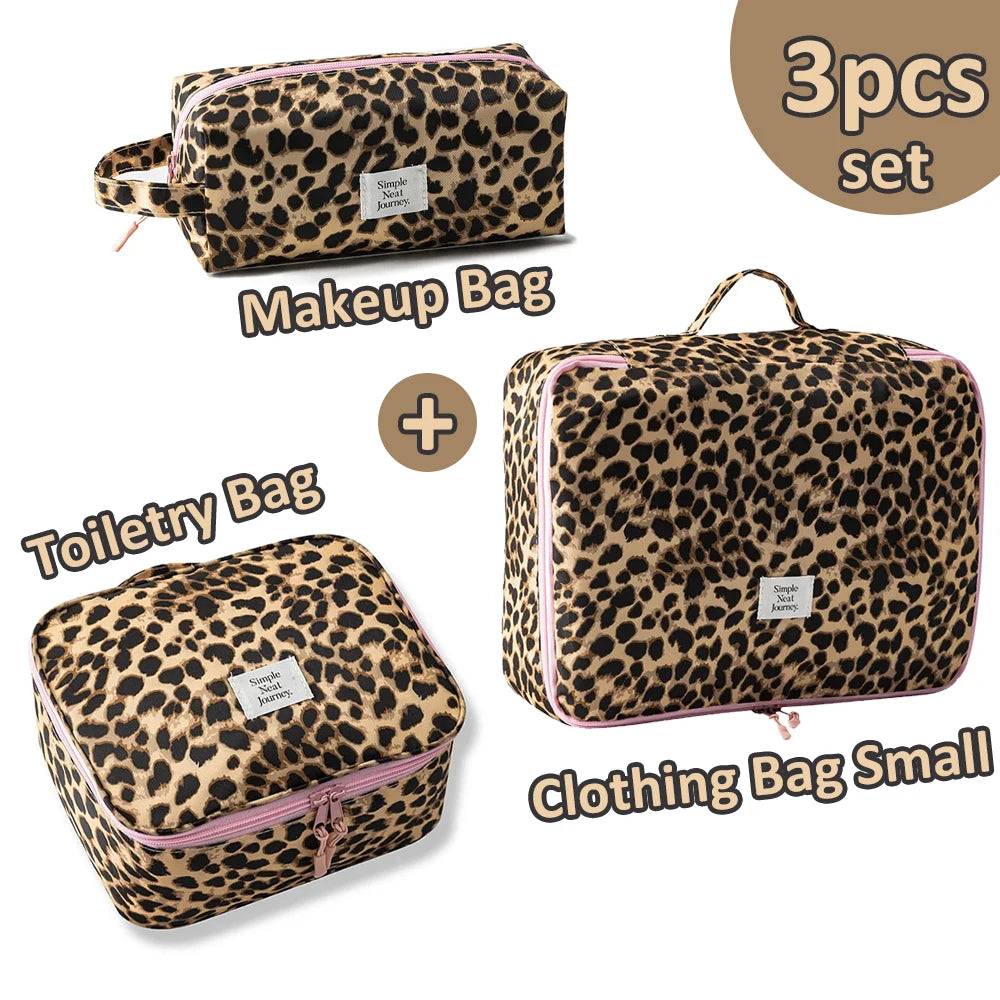 A set of three leopard print bags including a makeup bag and two small clothing bags.