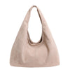 A light beige retro suede shoulder tote bag shown from the front.