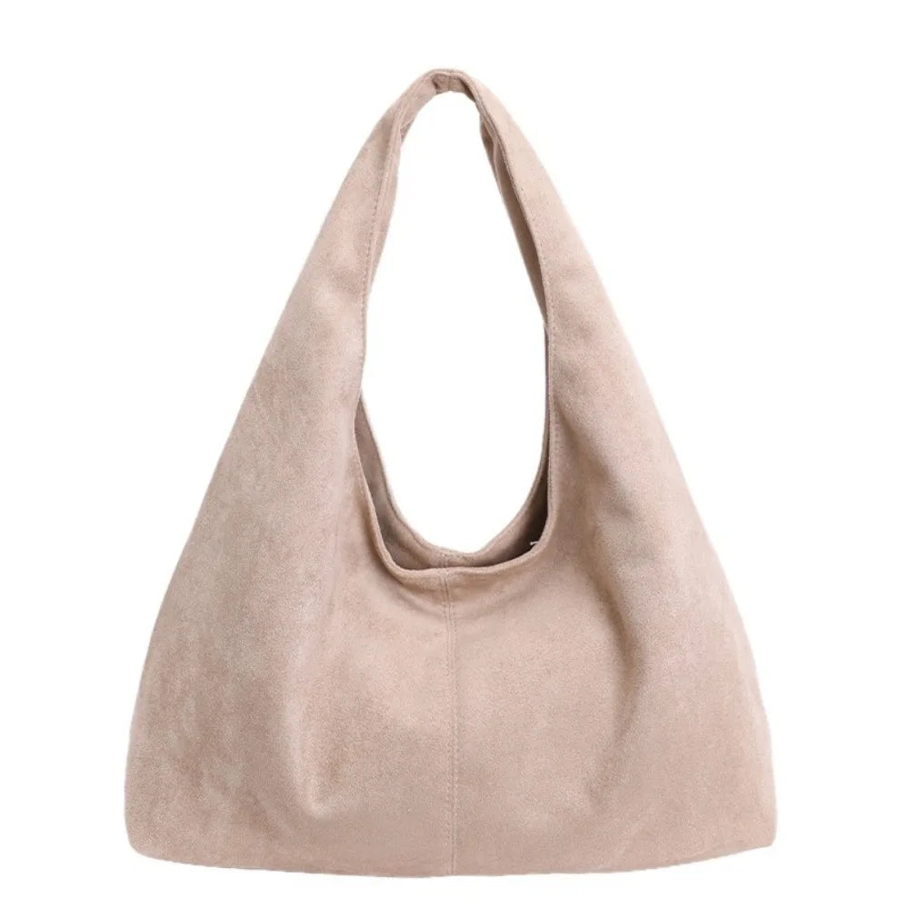 A light beige retro suede shoulder tote bag shown from the front.