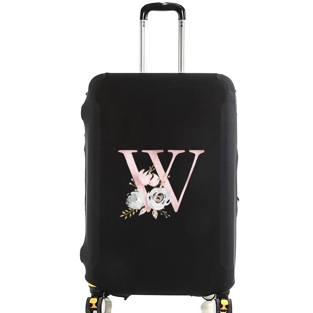 Black luggage with a pink floral monogram design on the side.