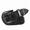 A close-up of a decorative Western buckle belt made of black metal with silver accents.