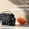 A black quilted cosmetic case with multiple separate pockets is shown next to skincare products and jewelry.