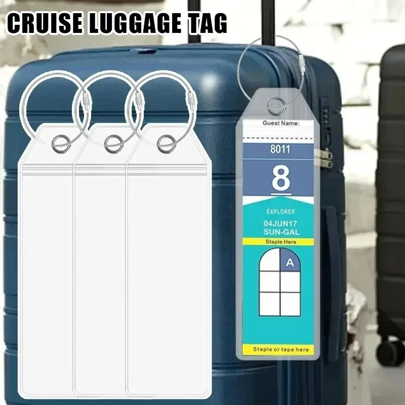 A blank cruise luggage tag is displayed hanging from a steel ring on a blue rolling suitcase.