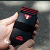 A hand holds a black and red card with one hand design featuring the website casekeybag.com