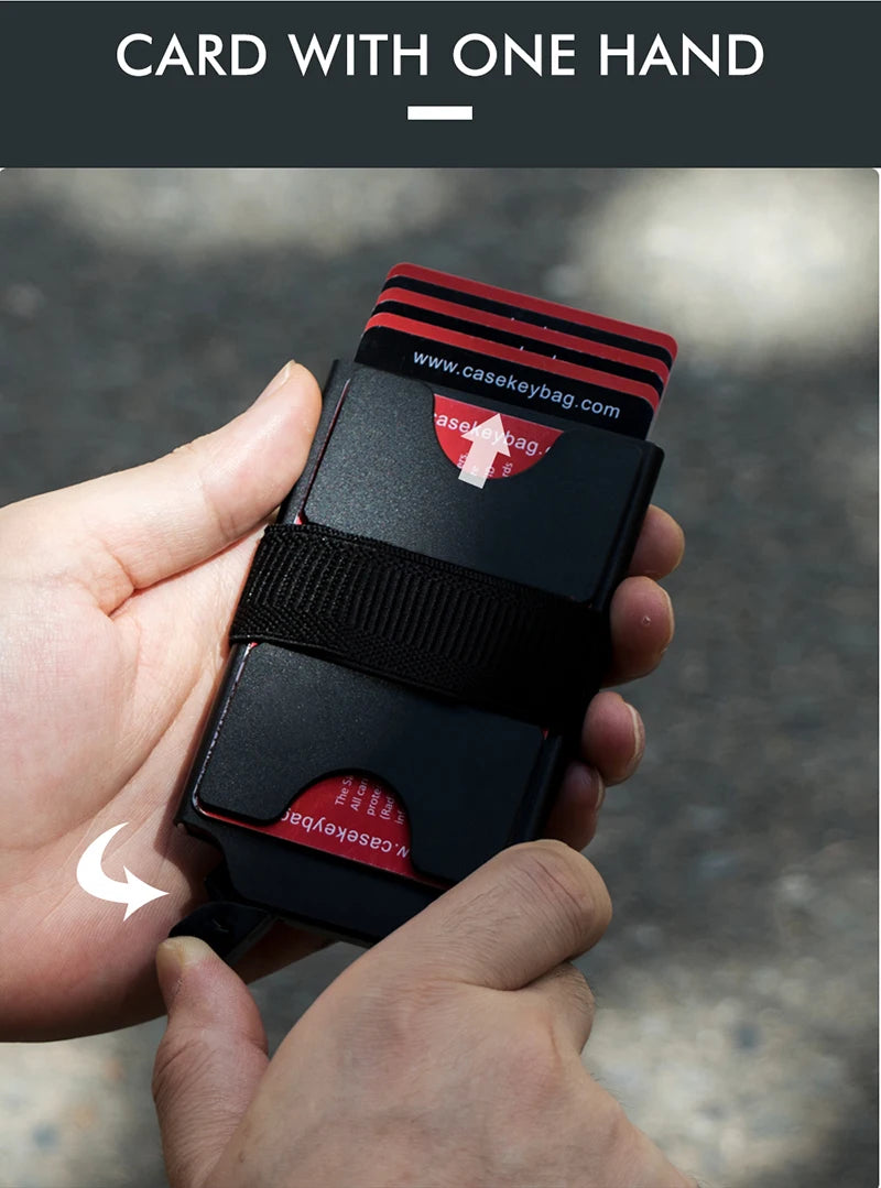A hand holds a black and red card with one hand design featuring the website casekeybag.com