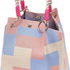 A knitted bucket bag featuring a geometric colorblock pattern in shades of pink, blue, and beige with a striped handle.