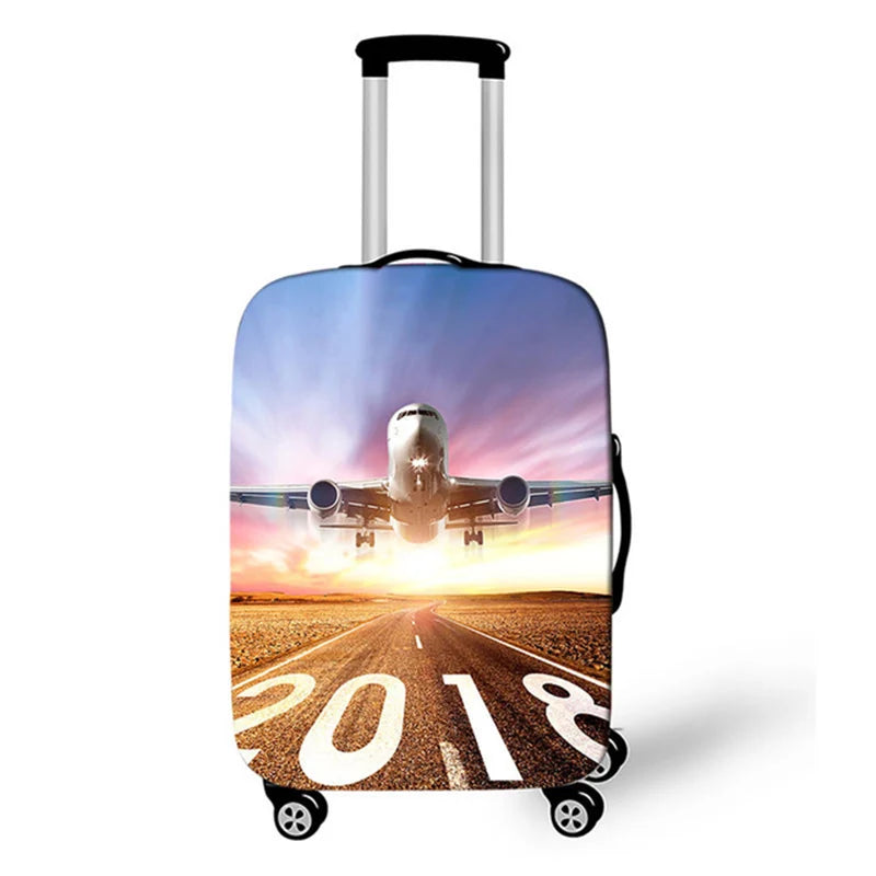 A silver rolling suitcase with a vibrant sunset landscape on the cover.