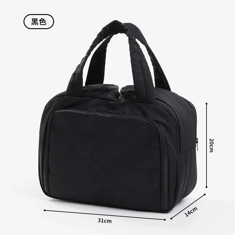 Black multipocket travel toiletry bag shown from the top with handles and dimensions.