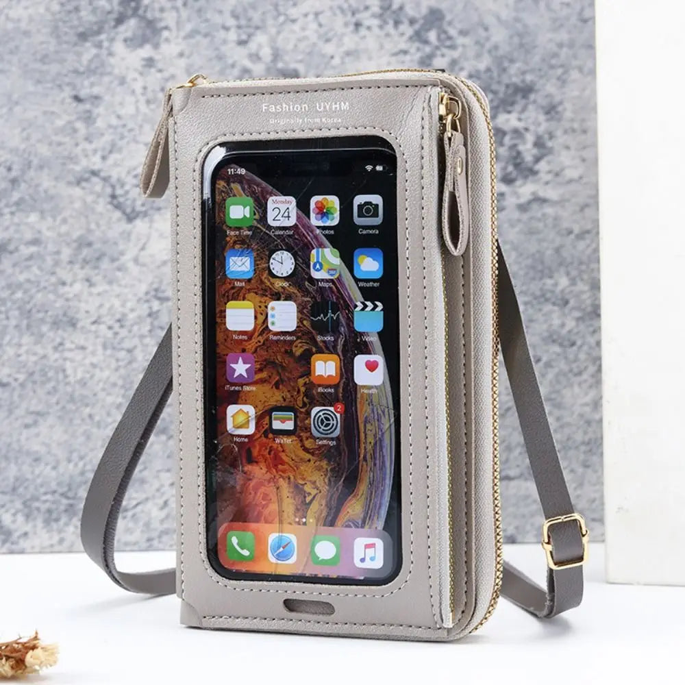 A light beige women's multi-color crossbody cell phone bag with a clear window displaying a smartphone.