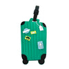 A green rolling luggage item with multiple attached tags.