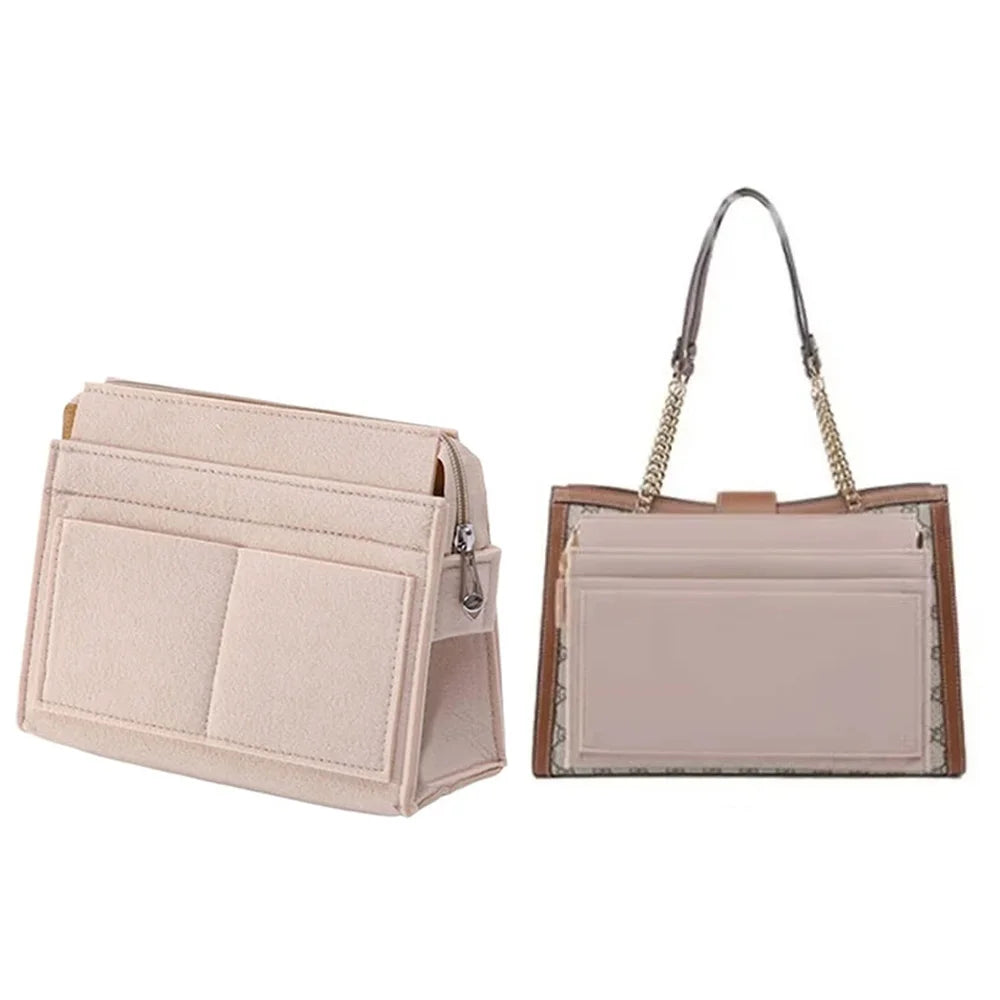 A light pink multi-pocket felt purse organizer with a gold chain strap.