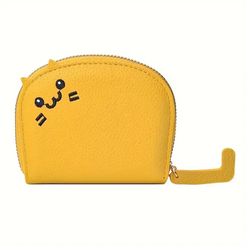 A yellow faux leather wallet with a cartoon cat face design and a gold zipper pull.