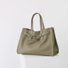 A beige genuine leather women's shoulder tote bag shown from the front.