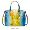 Blaues und goldenes Krokodilmuster Top-Handtasche mit Crossbody-Gurt.