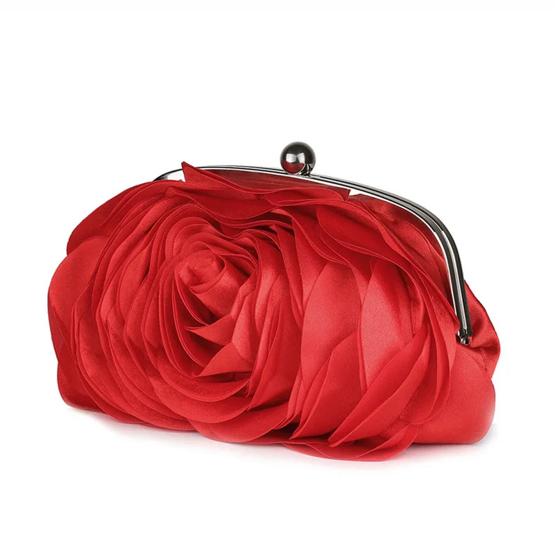A vibrant red rose floral evening clutch bag with a silver chain strap.
