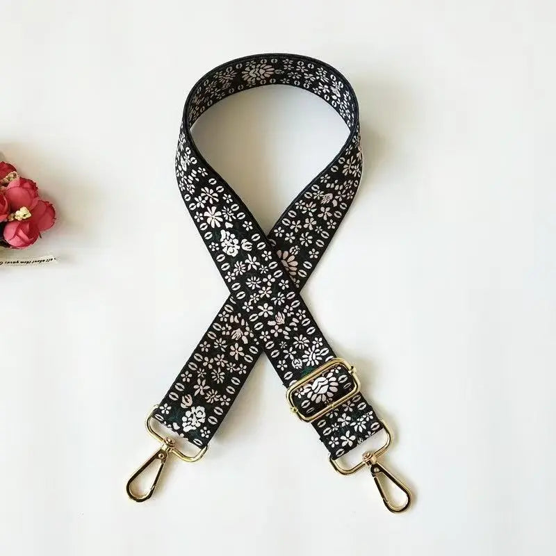 Black patterned nylon strap with gold hardware for bags and luggage