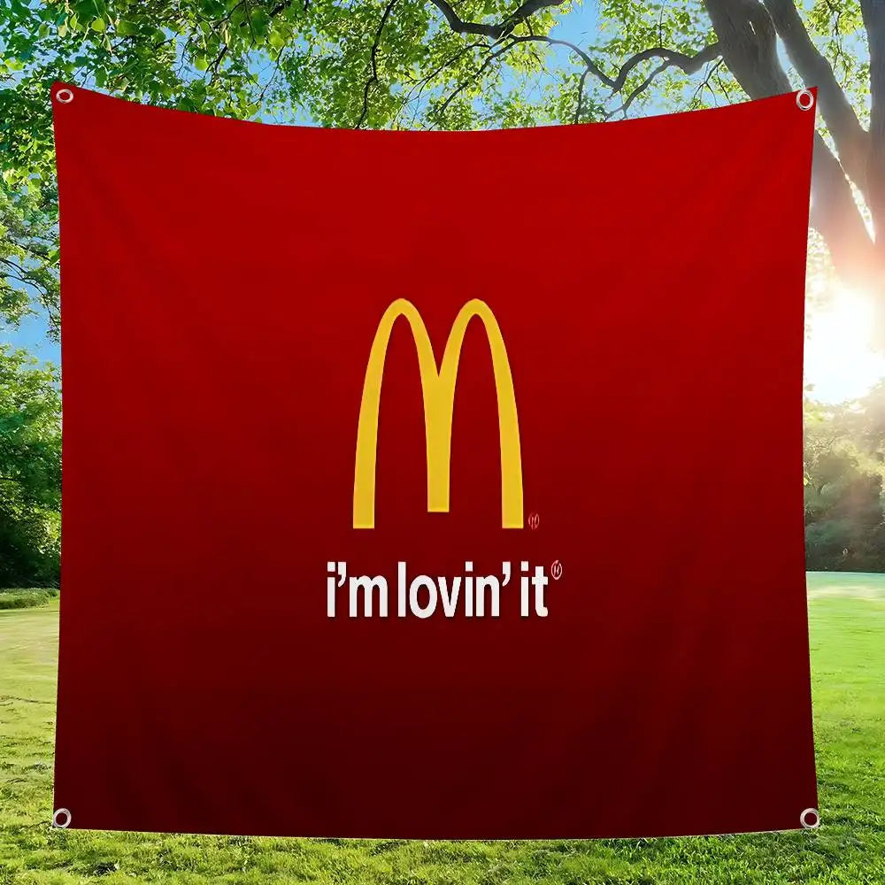 A red banner featuring the McDonald's golden arches logo and the text I'm lovin' it, displayed outdoors.