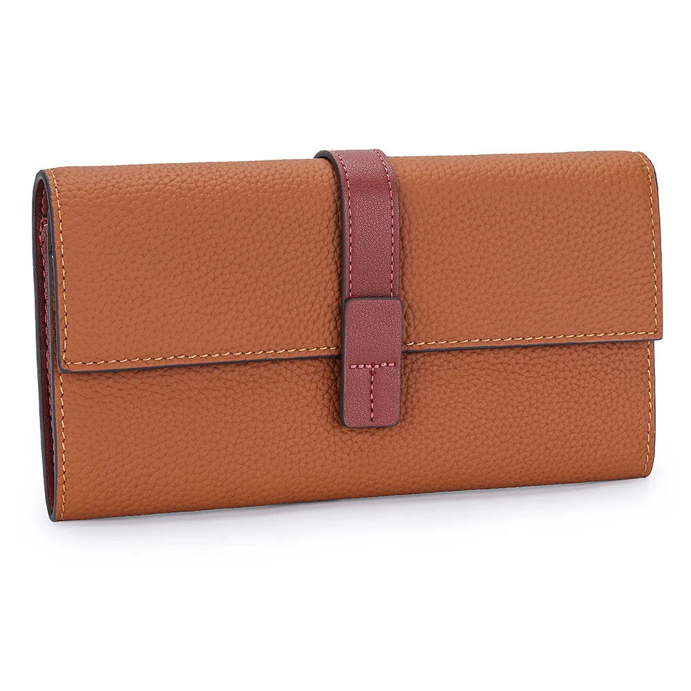 A brown genuine cow leather bifold wallet with a stitched edge and a leather strap.