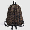 A brown leopard print backpack shown from the back with black straps.
