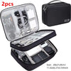 A set of two black portable digital organizer storage pouches, one zippered and one open for accessories.