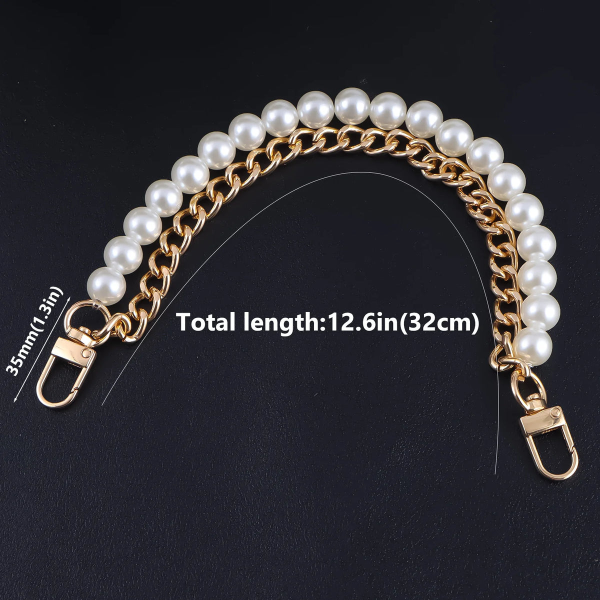 A gold-toned pearl chain shoulder strap with a clasp and a lobster claw hook.