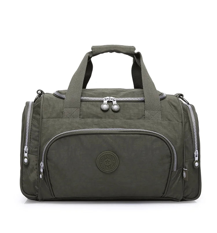 A dark olive green durable nylon travel duffle bag with padded straps and zippers.