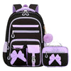 A black and purple 3-piece cartoon school bag set for girls featuring a backpack and a separate pouch.